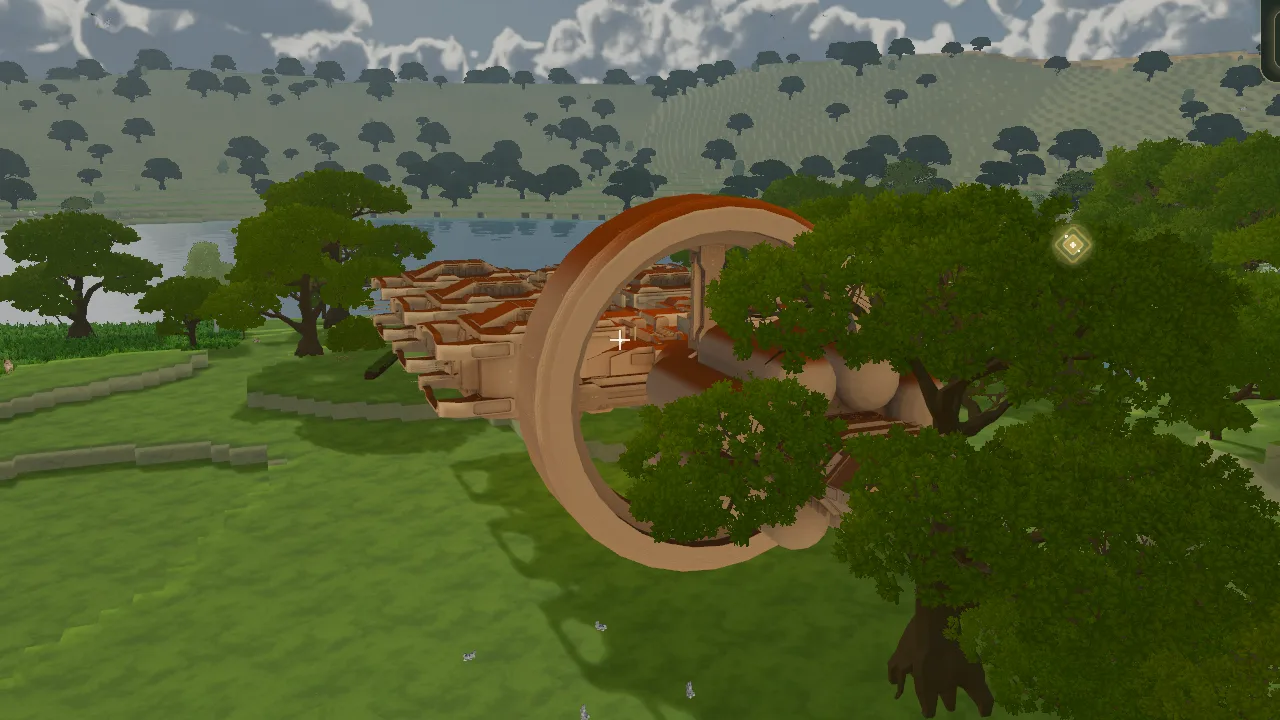 The Ark's ring and hull rising in the meadow beside the lake